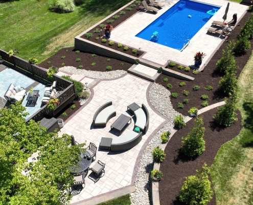 Backyard pool and landscaping project by Upscale Lawncare