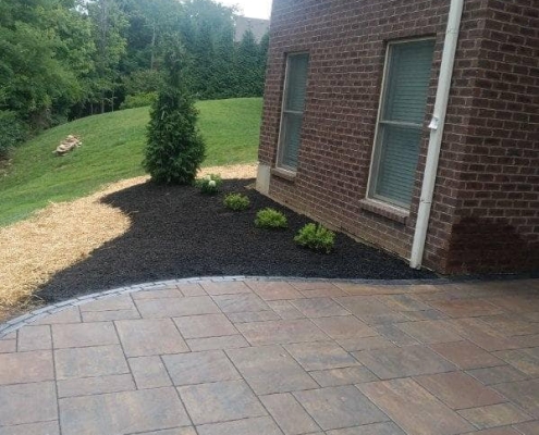 backyard landscaping installation with unilock pavers in Green Township, Ohio