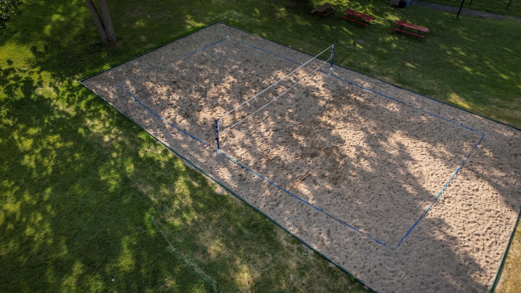 Image of a volleyball court installation at the Three Rivers Swim Club.