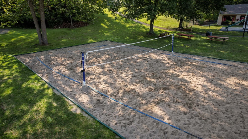 Image of a volleyball court installation at the Three Rivers Swim Club.