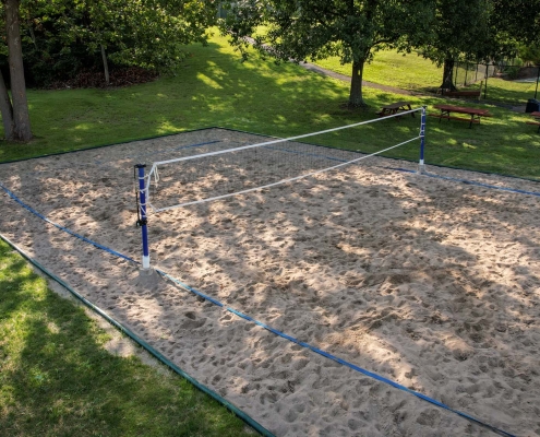 Image of a volleyball court installation at the Three Rivers Swim Club.