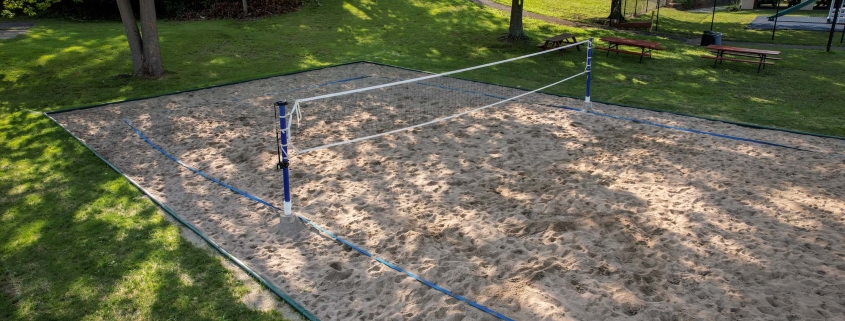 Image of a volleyball court installation at the Three Rivers Swim Club.