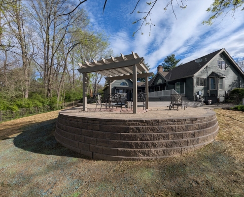 After photo of paver patio restoration and retaining wall