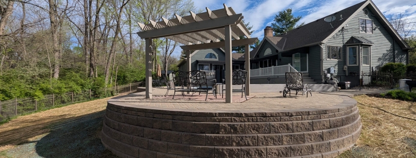 After photo of paver patio restoration and retaining wall